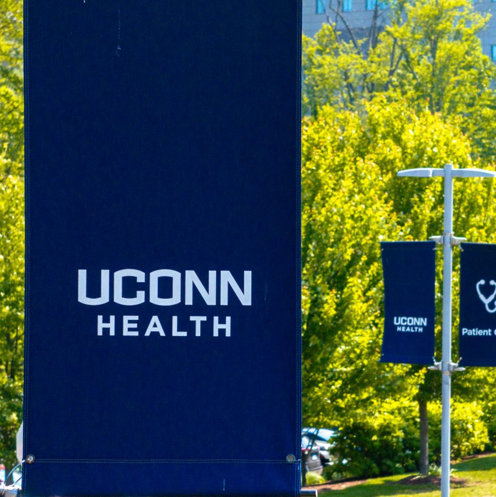 Blue "UConn Health" sign with white letters
