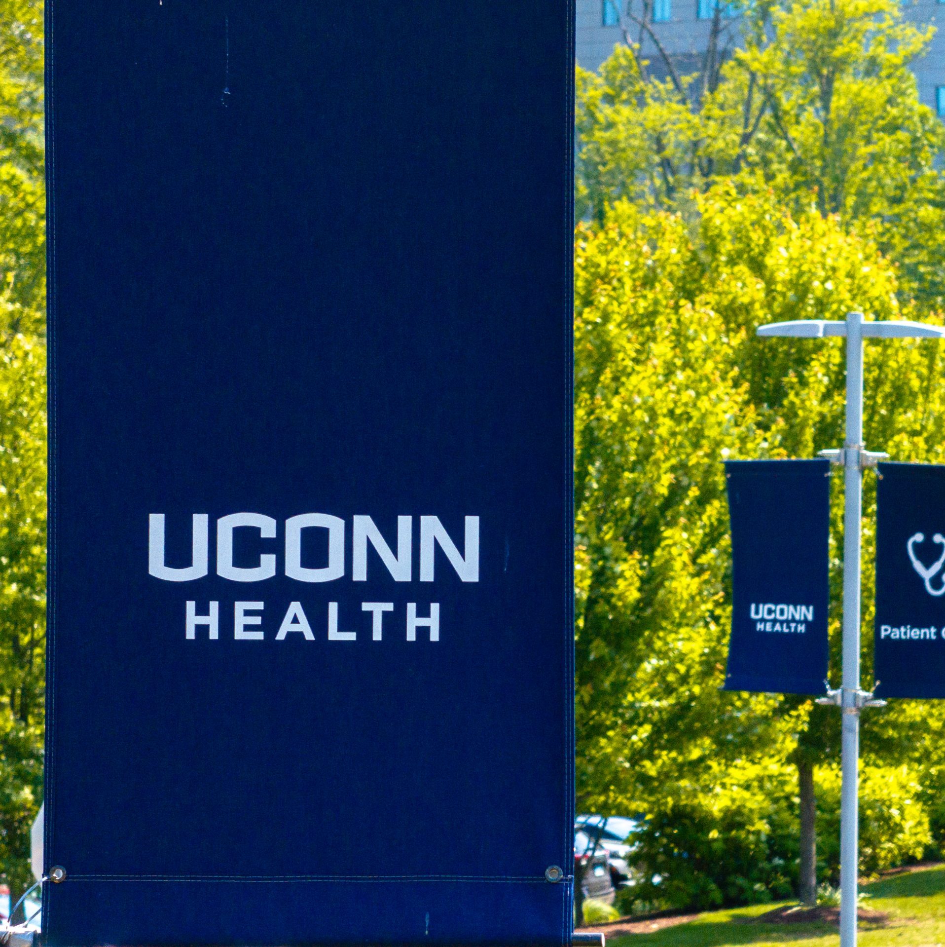 Blue "UConn Health" sign with white letters